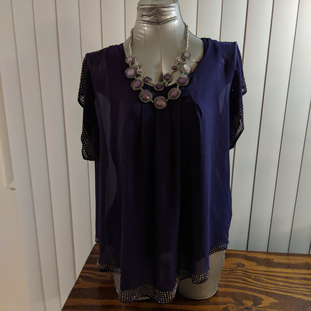 Dark purple blouse with necklace